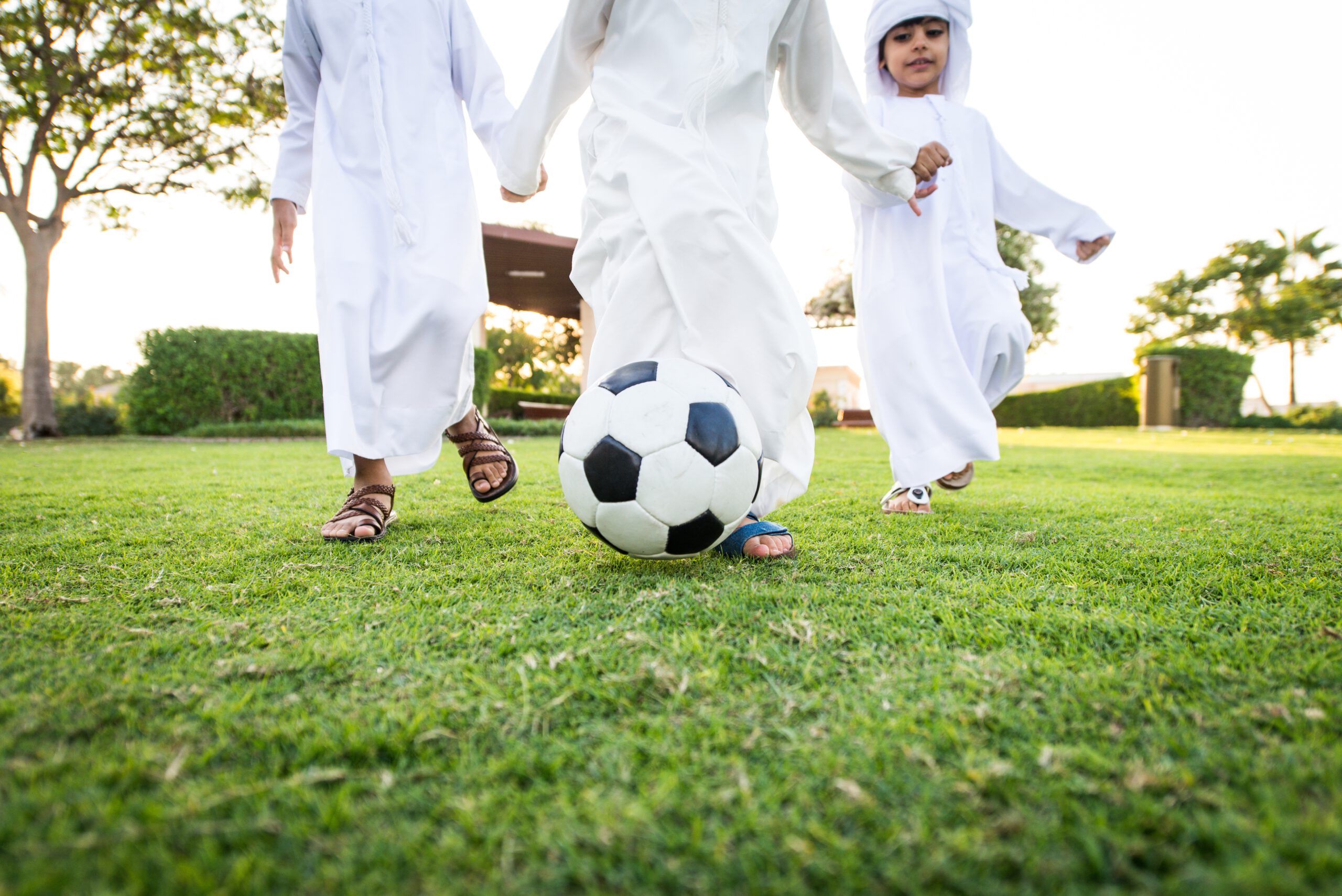 What to do in Dubai with kids - Kids playing football